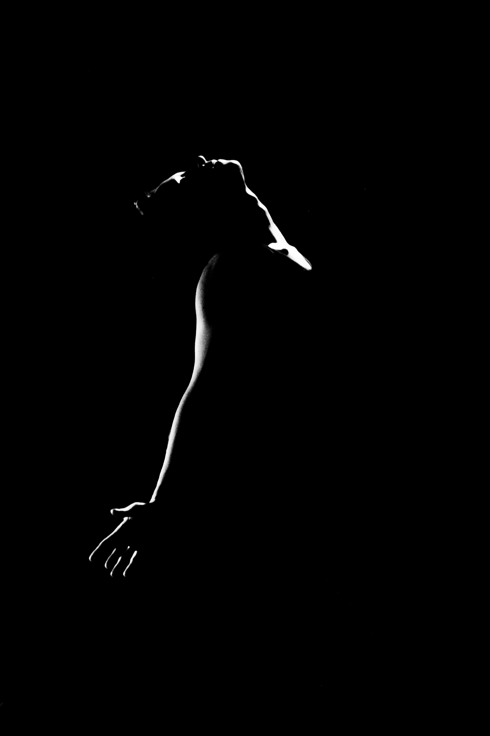 Silhouetted performer from Refleksija